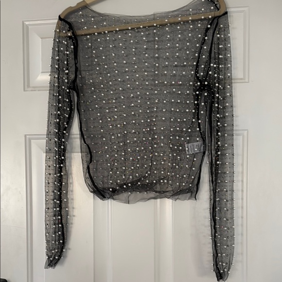 the post Tops - Sheer Black Long Sleeve Top with Pearl Accents